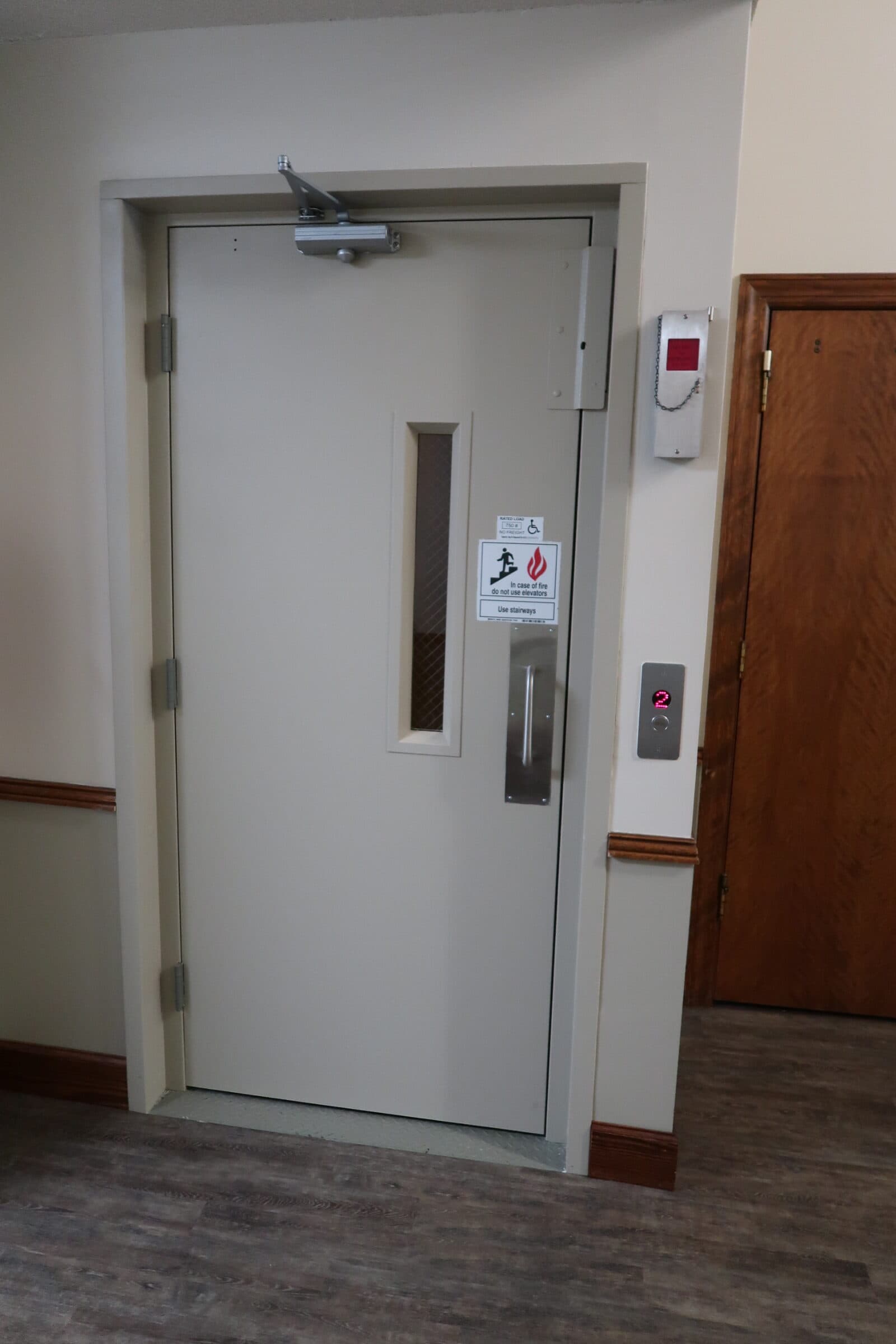 Hybrid Lift with showing door closed with stainless steel fixtures