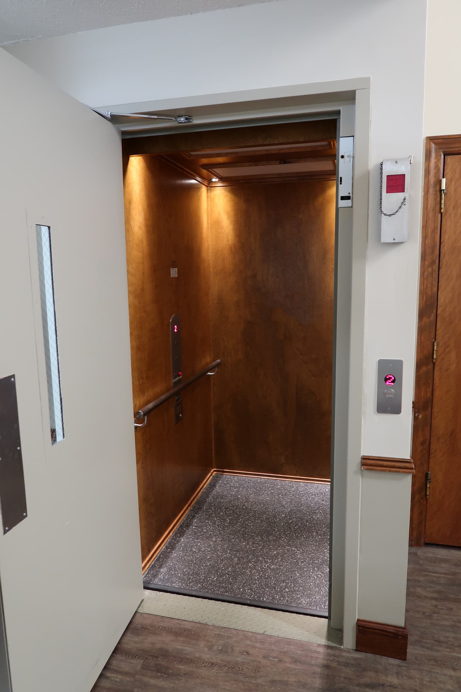 Hybrid Lift with Country Pine Stain on Birch flat panels and brushed stainless steel fixtures