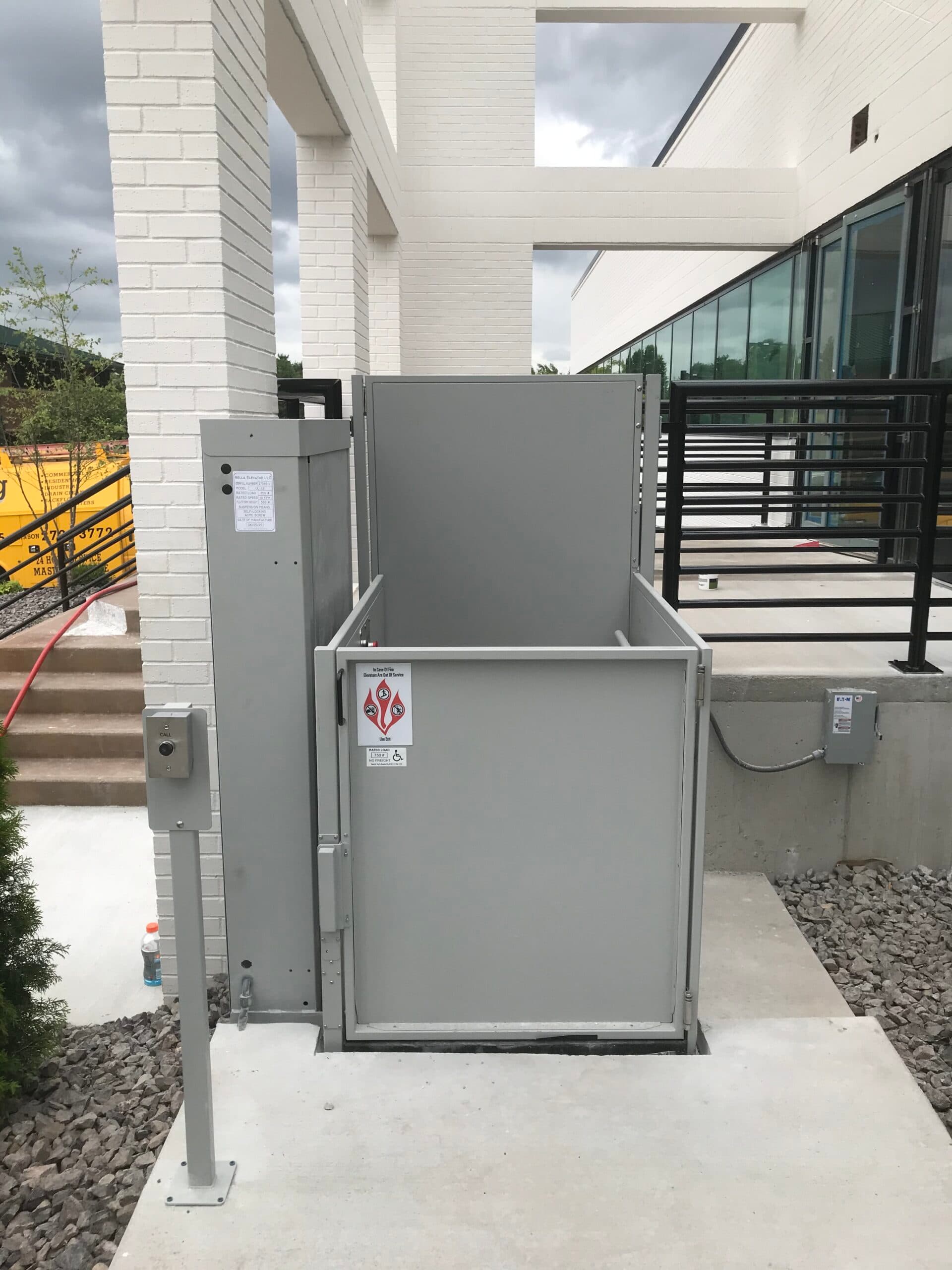 symmetry unenclosed lift outdoor with pedestal mount call and grey finish