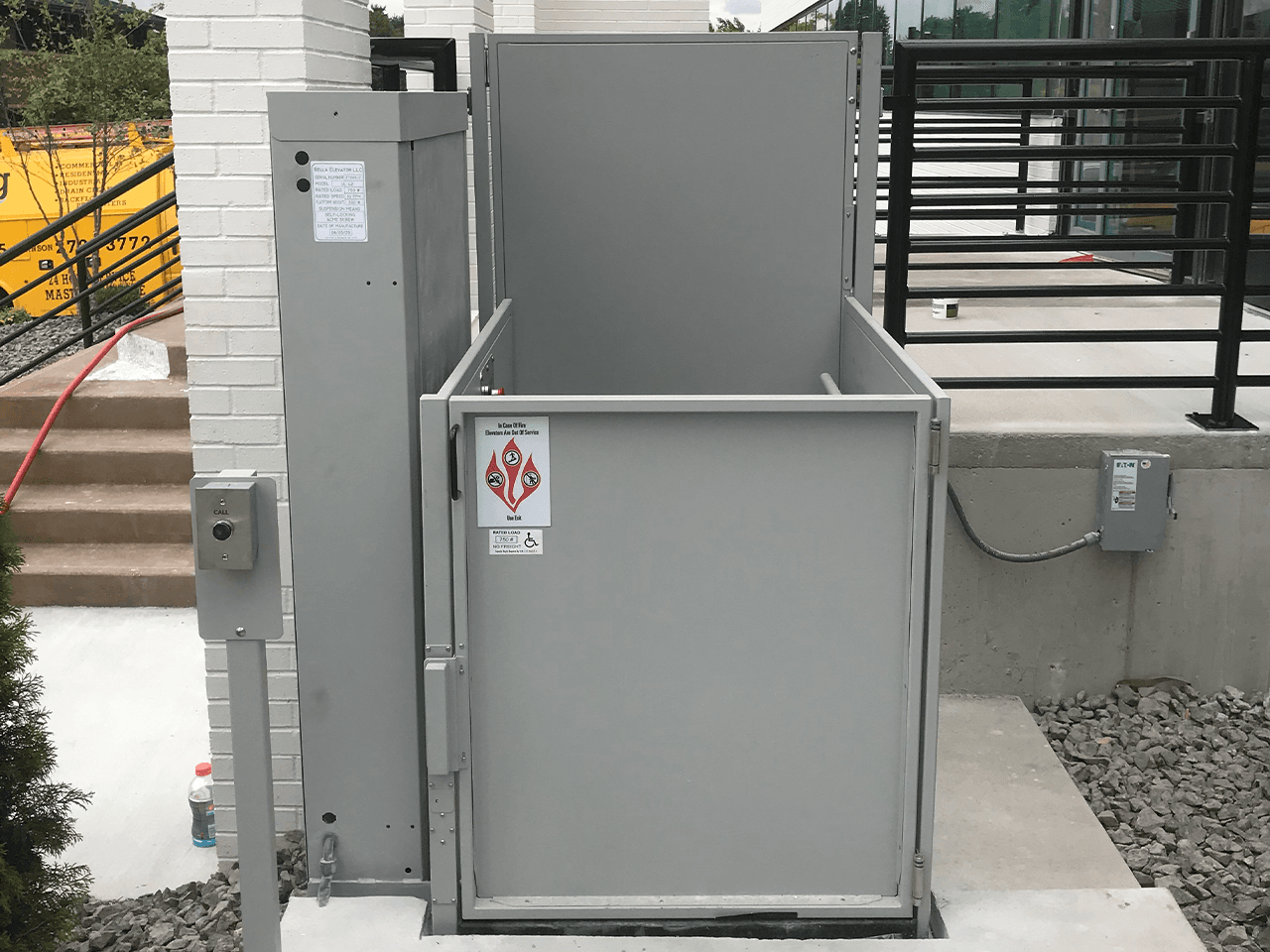 symmetry unenclosed lift outdoor with pedestal mount call and grey finish