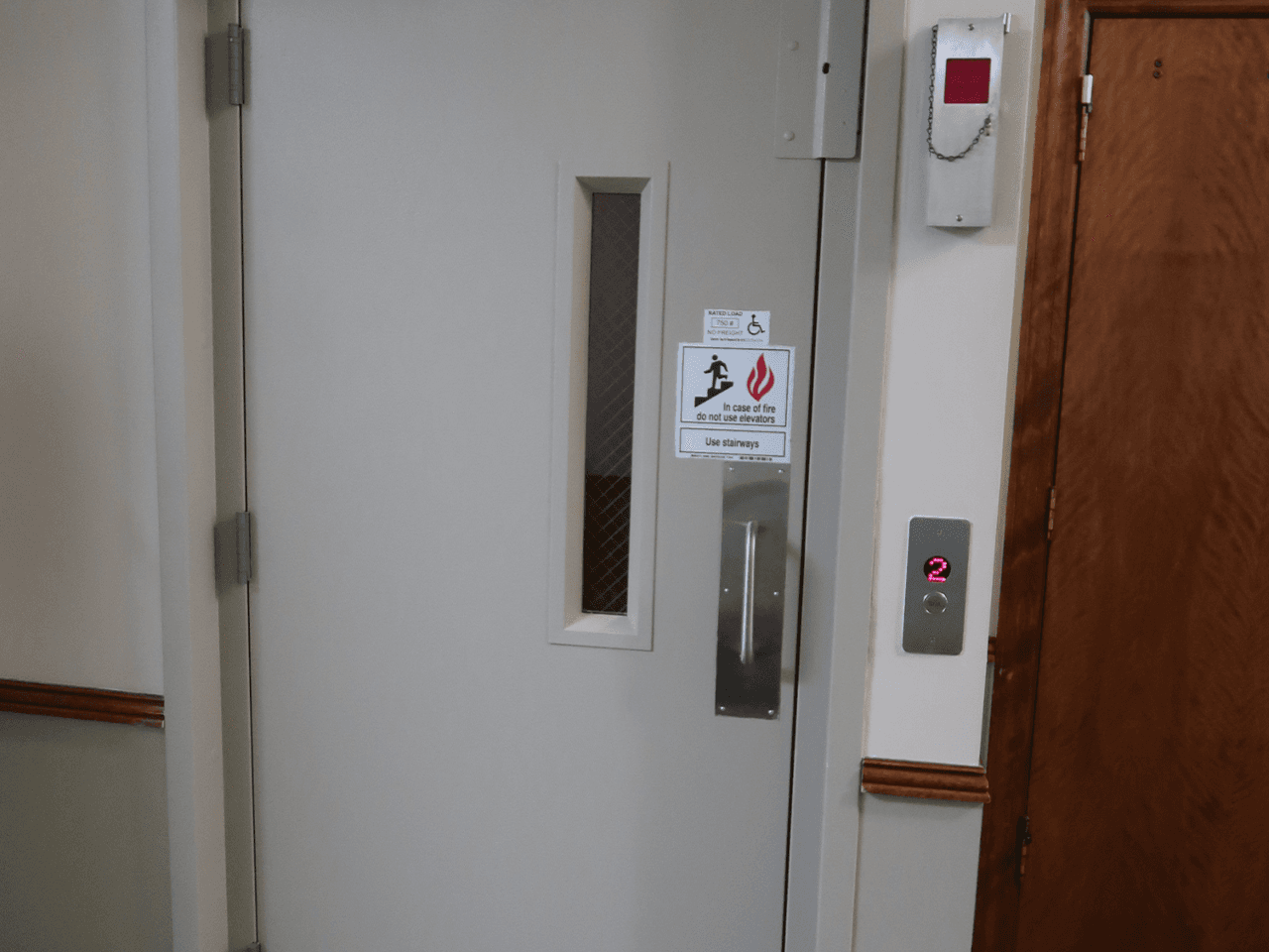 Hybrid Lift with showing door closed with stainless steel fixtures
