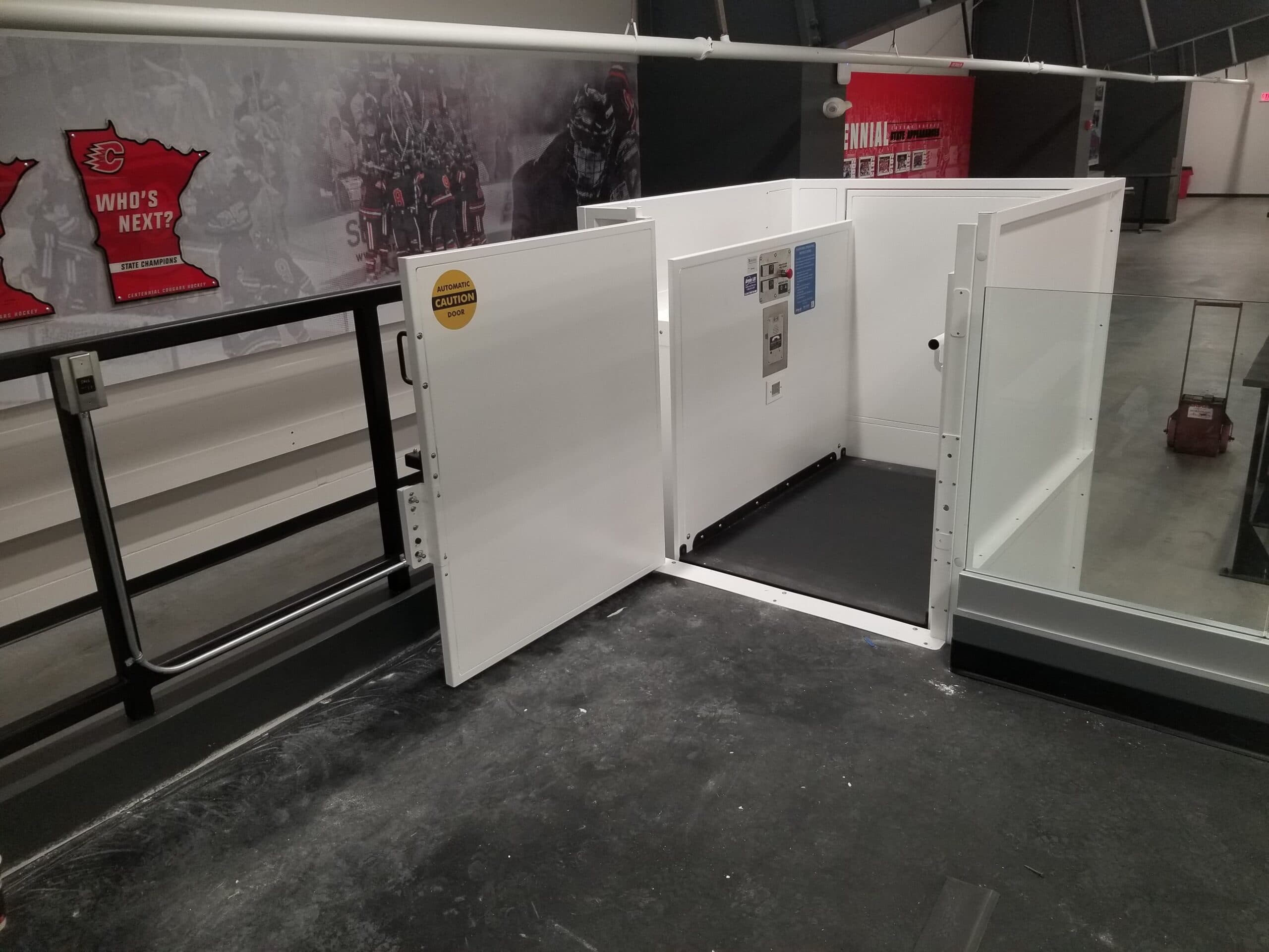 symmetry white enclosed lift at sports arena