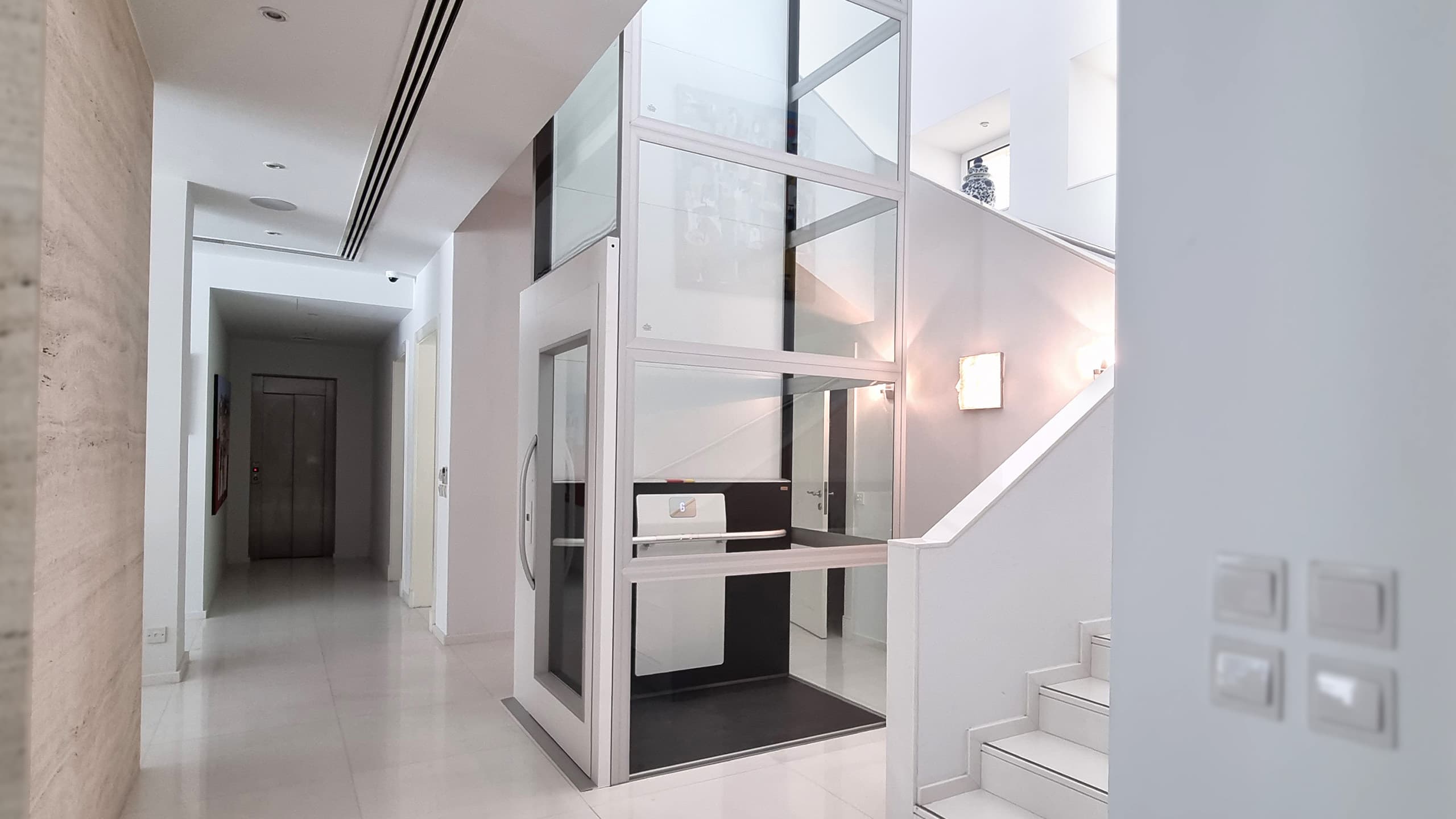 cibes air home lift elevator installed between two floors in a residential space