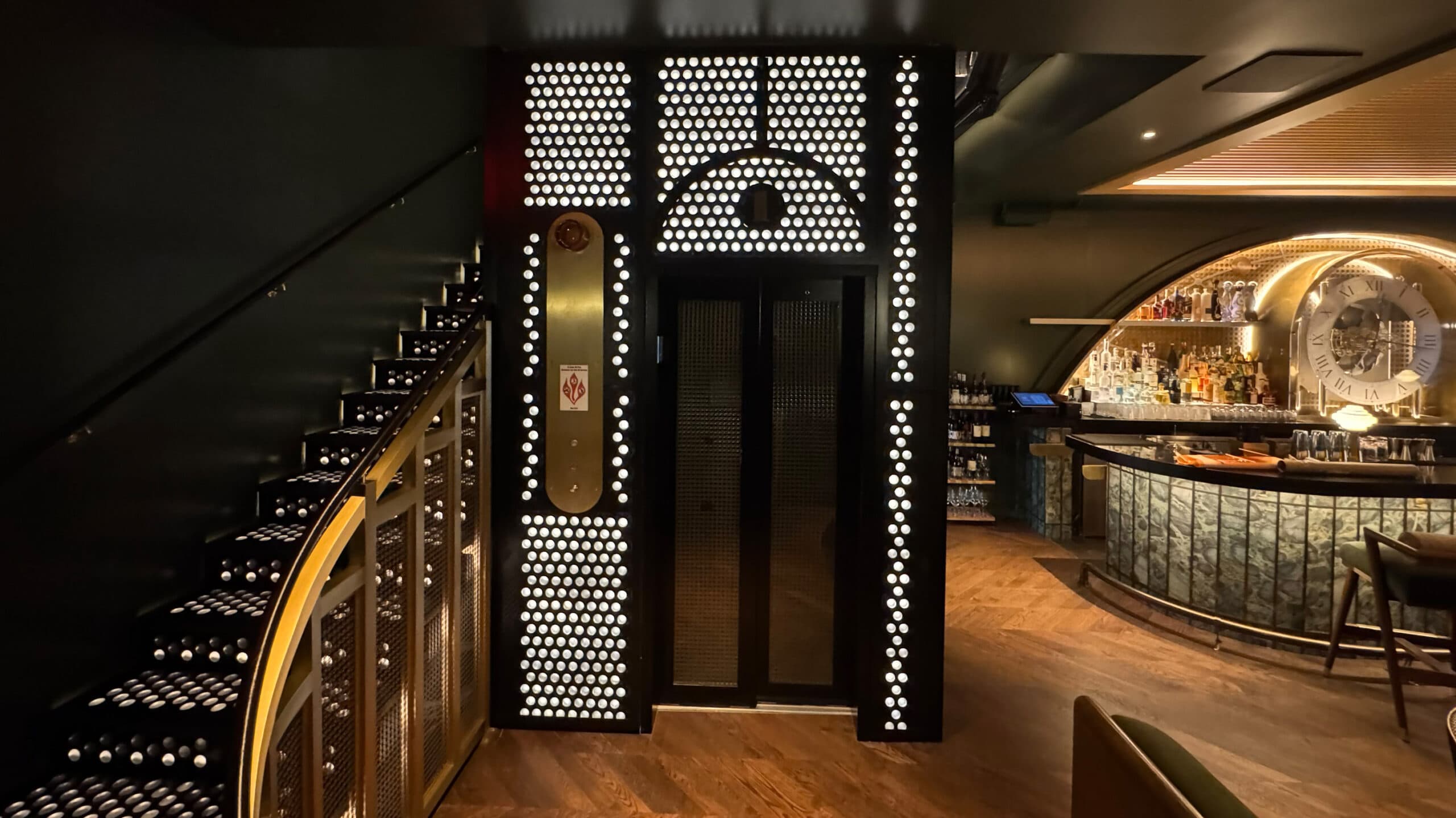 Glass door Symmetry LULA elevator integrated into restaurant architecture