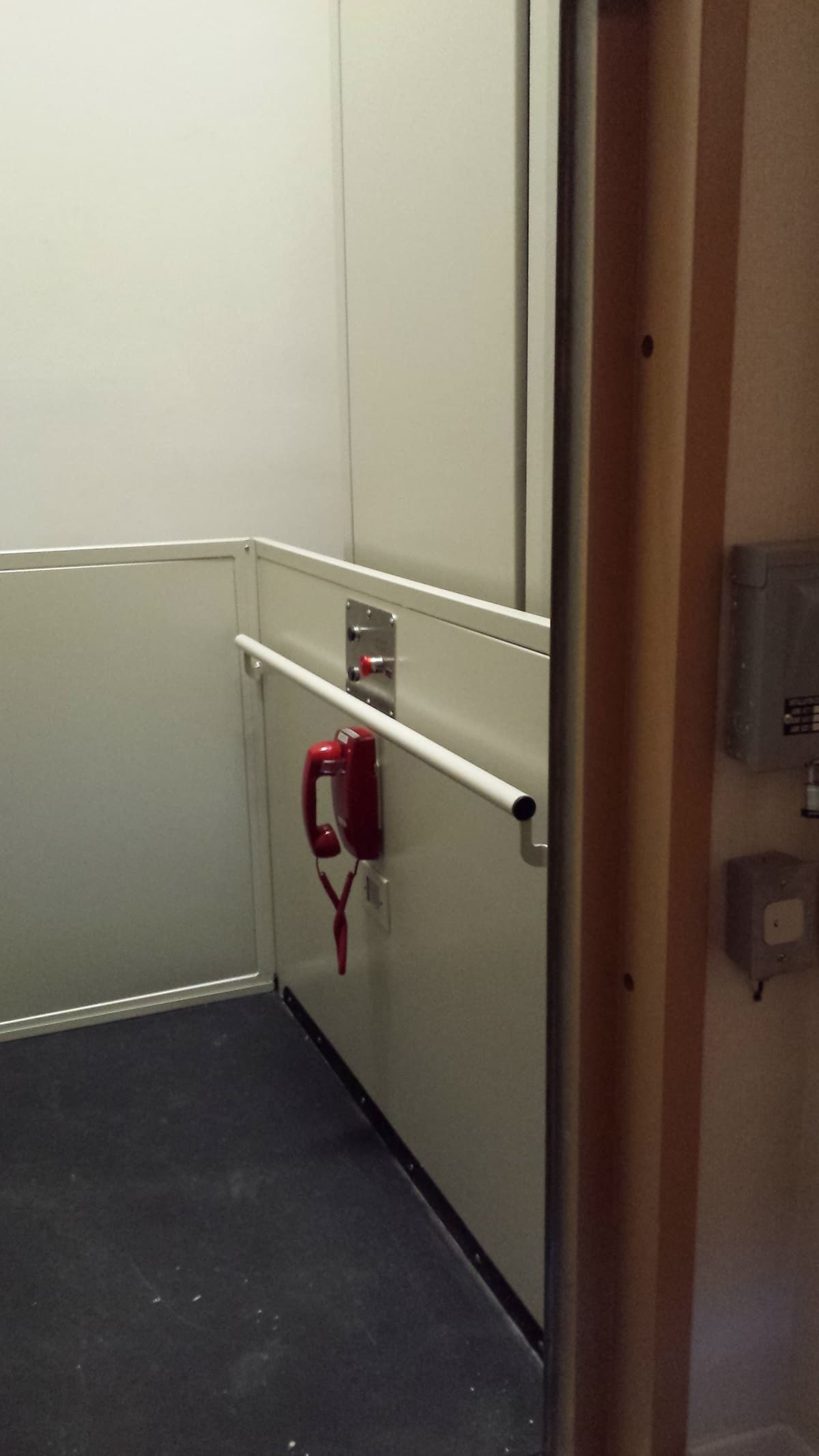 shaftway lift interior in ivory with phone by others